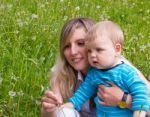 Young Mother With Her Little Son Stock Photo