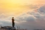 Young Man  Asia Tourist  At Mountain Is Watching Over The Misty Stock Photo