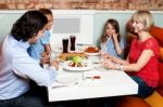 Happy Family Enjoying Dinner Stock Photo