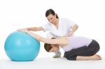 Woman With Physiotherapist Stock Photo