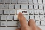 Finger Pressing Keyboard Key Written 2019 New Year On Laptop Stock Photo