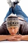 Laying Man Wearing Woollen Cap Stock Photo