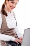 Cute Girl Typing On Laptop Stock Photo