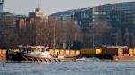 Reclaim Pulling Containers Down The River Thames Stock Photo