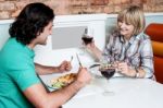 Couple Enjoying Dinner At A Restaurant Stock Photo