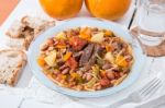 Brown Beans With Meat And Carrot Stock Photo