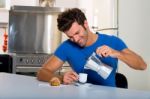 Man Having Tea In Kitchen Stock Photo