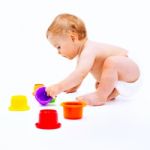 Cute Infant Boy With Toys Stock Photo