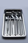 Dental Tools On Plate Stock Photo