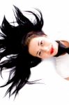 Beautiful Woman Laying Down With Hair Spread Stock Photo