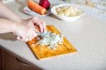 Woman Cuts Onion Stock Photo