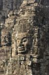 Ancient Stone Faces Of King Jayavarman Vii At The Bayon Temple, Stock Photo