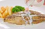 Fish Steak With Sauce Stock Photo