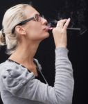 Smoking Electric Cigarettes On The Black Background Stock Photo