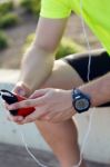 Handsome Young Man Listening To Music After Running Stock Photo