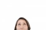 Closeup Portrait Of A Young Woman Looking Up Isolated On White B Stock Photo