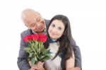 American Young Couple With Bunch Of Roses Stock Photo