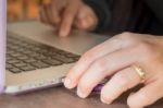 Woman's Hand Using Touch Pad Of Laptop Stock Photo