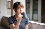 Portrait Of Thai Adult Beautiful Girl Drinking Coffee Stock Photo