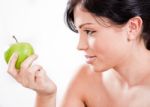 Beautiful Woman Holding A Green Apple Stock Photo