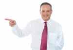 Businessman Pointing Away Stock Photo