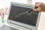 Businessman Point And Analyze Forex Graph Or Stock Graph By Use Pen In Right Hand Stock Photo