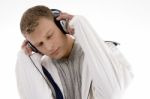 Young Handsome Man Enjoying Music With Headphones Stock Photo