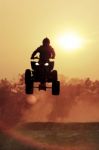 Silhouette Atv Jump On Dirt Track Stock Photo