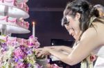 Happy Bride And Groom Cutting The Wedding Cake Stock Photo