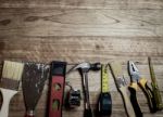 Set Of Tools Over A Wood Background Stock Photo