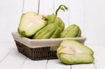 Chayote Fruit On White Wood Background Stock Photo