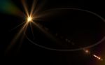 Digital Lens Flare In Black Background Stock Photo