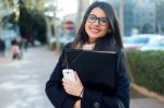 Young Beautiful Woman Looking At Camera In The Street Stock Photo