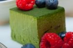 Green Tea Matcha Mousse Cake With Berries Stock Photo