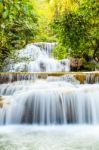 Tropical Waterfall In Kanchanaburi, Thailand Stock Photo