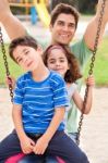 Kids Having Fun With Their Father Stock Photo