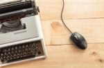 Old Typewriter Connected To A Computer Mouse Stock Photo