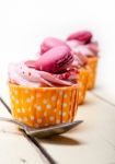 Pink Berry Cream Cupcake With Macaroon On Top Stock Photo