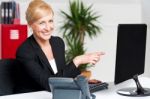 Businesswoman Pointing At Computer Stock Photo