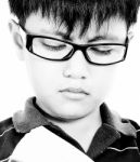 Child Improving His Education By Reading A Book Stock Photo