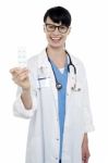 Bespectacled Duty Doctor Showing Medicine Strip Stock Photo