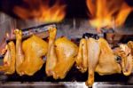 Chicken Roasting On Skewer Stock Photo