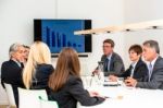 Mixed Group In Business Meeting Stock Photo