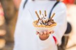 Closeup Of Ice Cream Held In Hand By Cute Girl Stock Photo