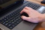 Man's Hand On A Computer Keyboard Stock Photo