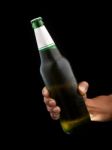 Beer Bottle In Hand Stock Photo