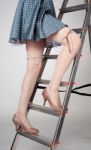 Slim Long Female Legs On Stairway Stock Photo