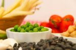 Variety Of Kitchen Ingredients With Fresh And Dried Legumes Stock Photo