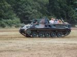 People Enjoying A Ride In An Armoured Car At Dunsfold Airfield Stock Photo