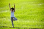 Girl Practicing Yoga Stock Photo